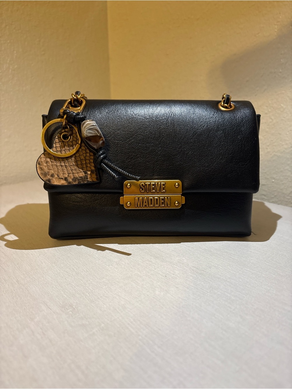 Steve Madden Black Leather Crossbody Bag with Gold Hardware and Charm